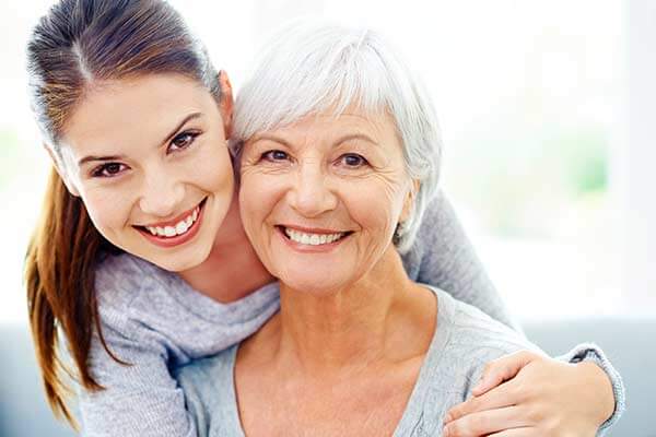 Young Woman and Older Woman Smiling