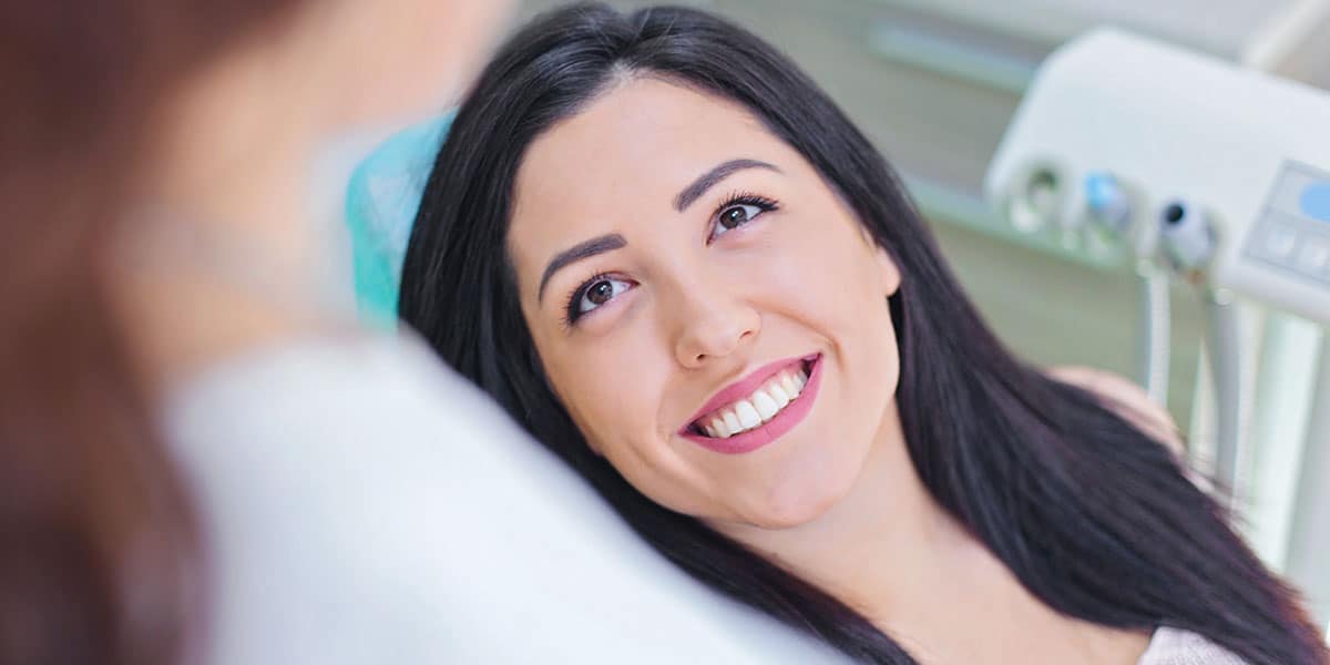 Smiling patient in dental chair